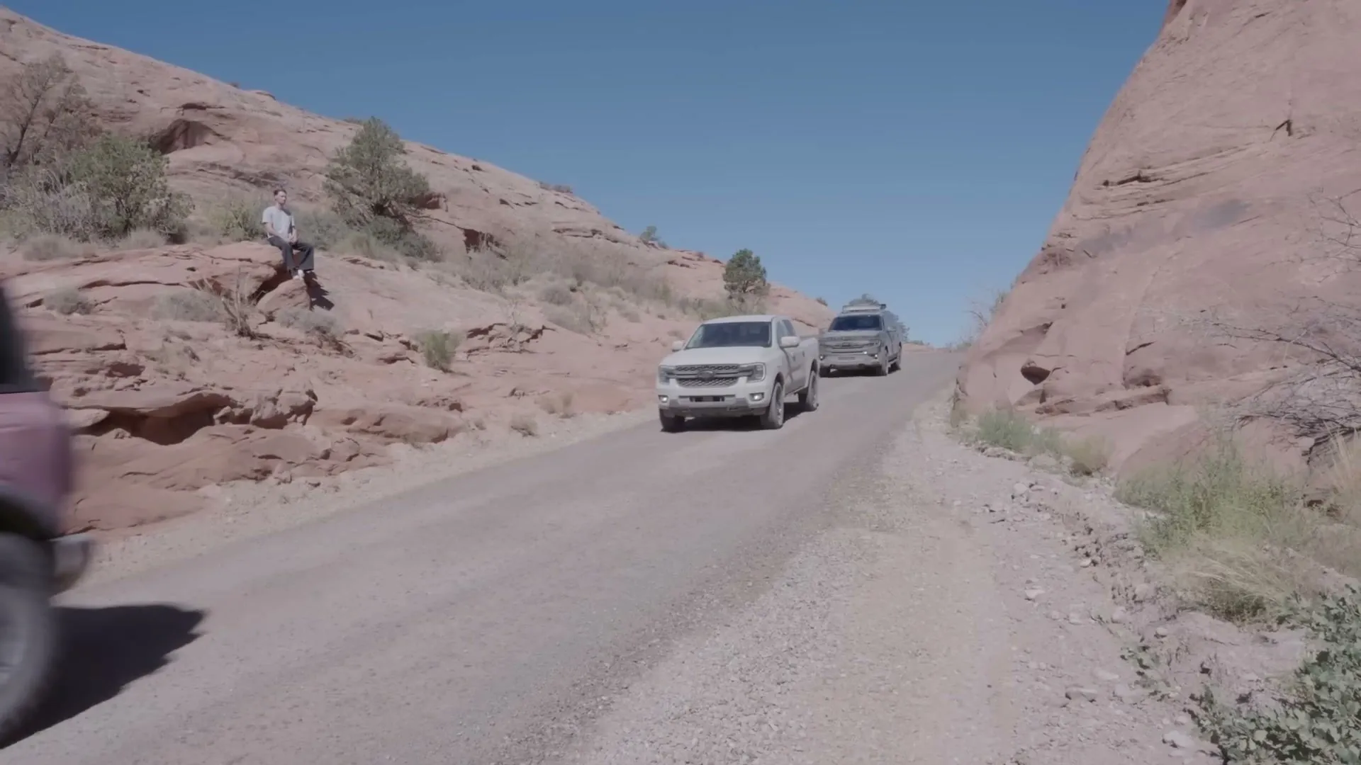 Rainbolt on the rocks, as the convoy passes.